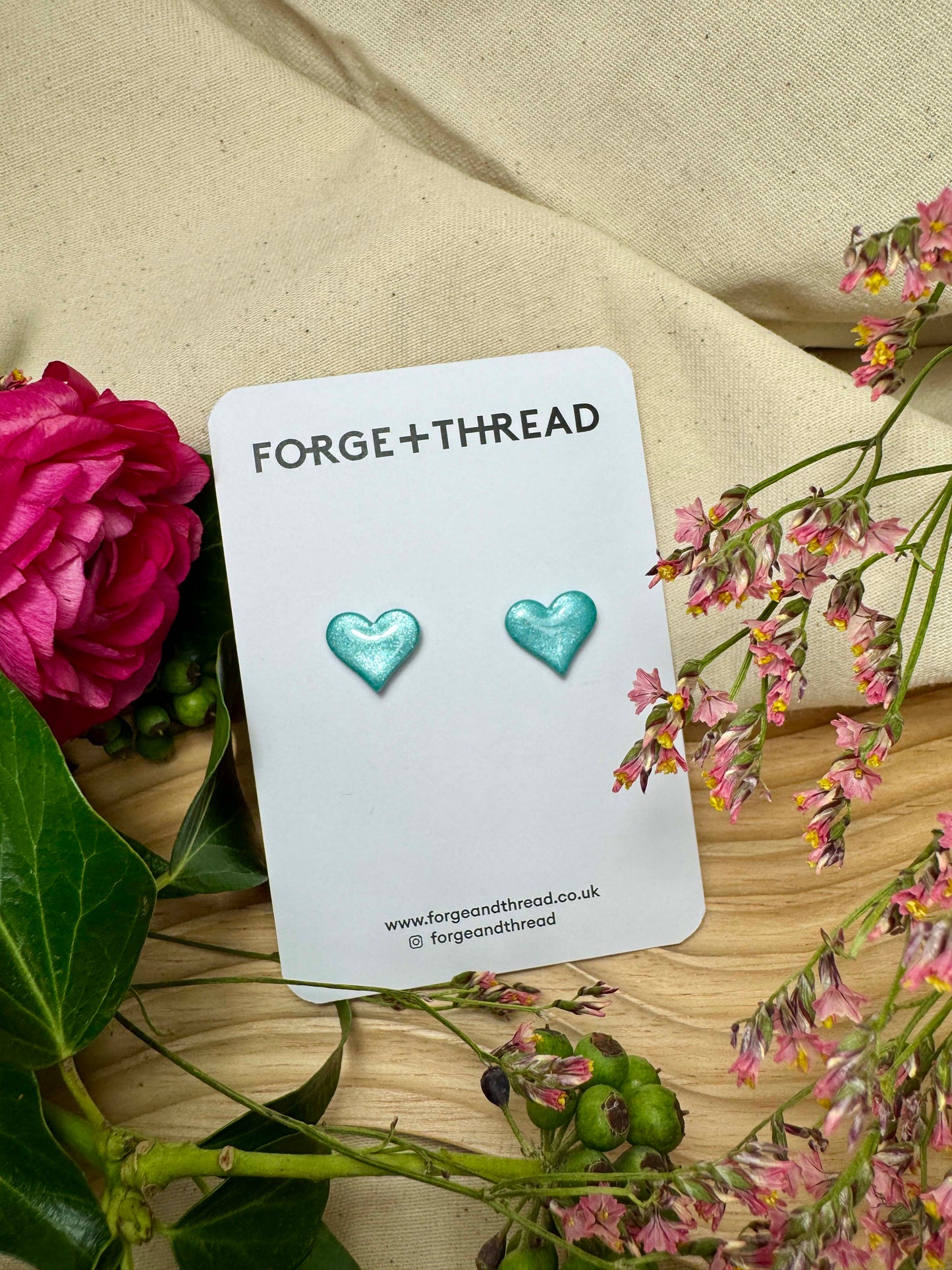 TURQUOISE METALLIC GLITTER HEART STUDS