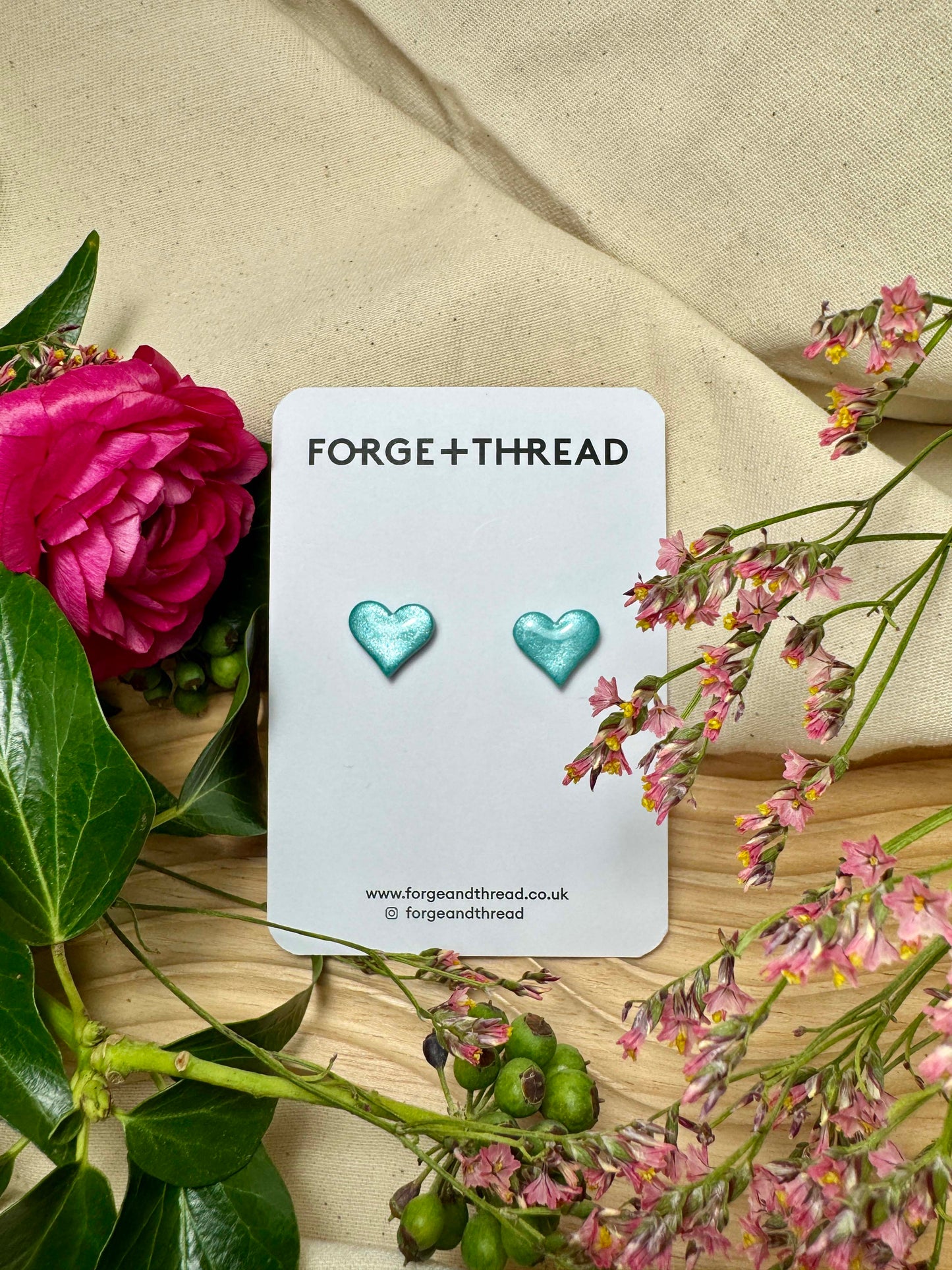 TURQUOISE METALLIC GLITTER HEART STUDS