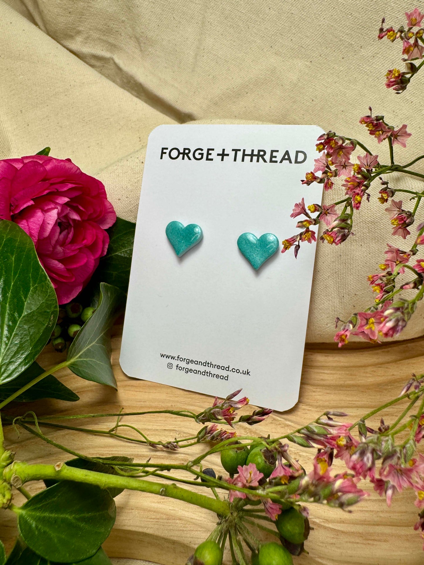 TURQUOISE METALLIC GLITTER HEART STUDS