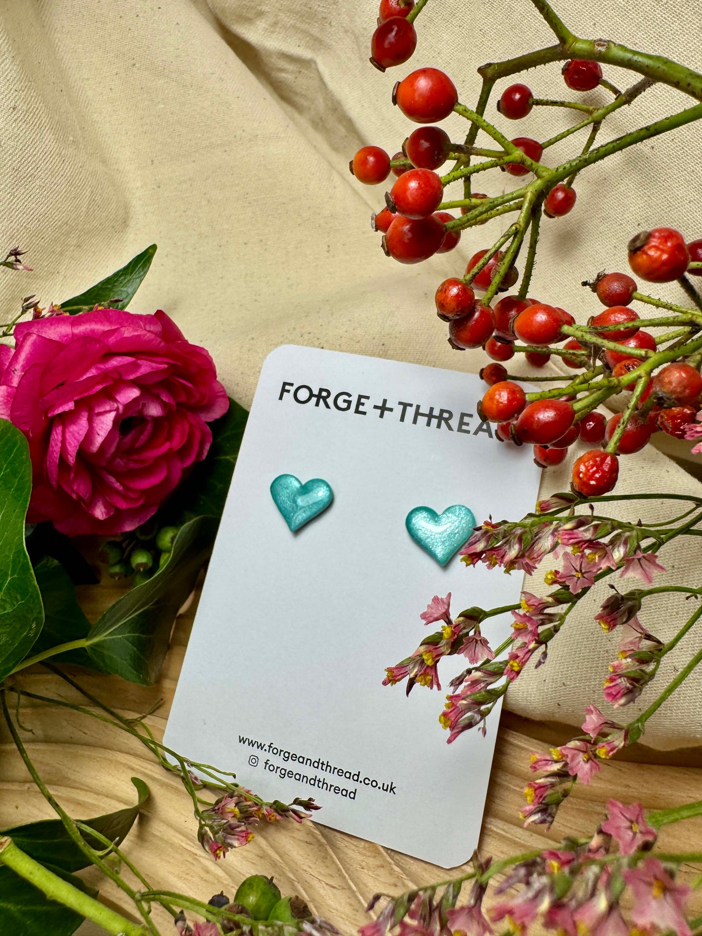 TURQUOISE METALLIC GLITTER HEART STUDS