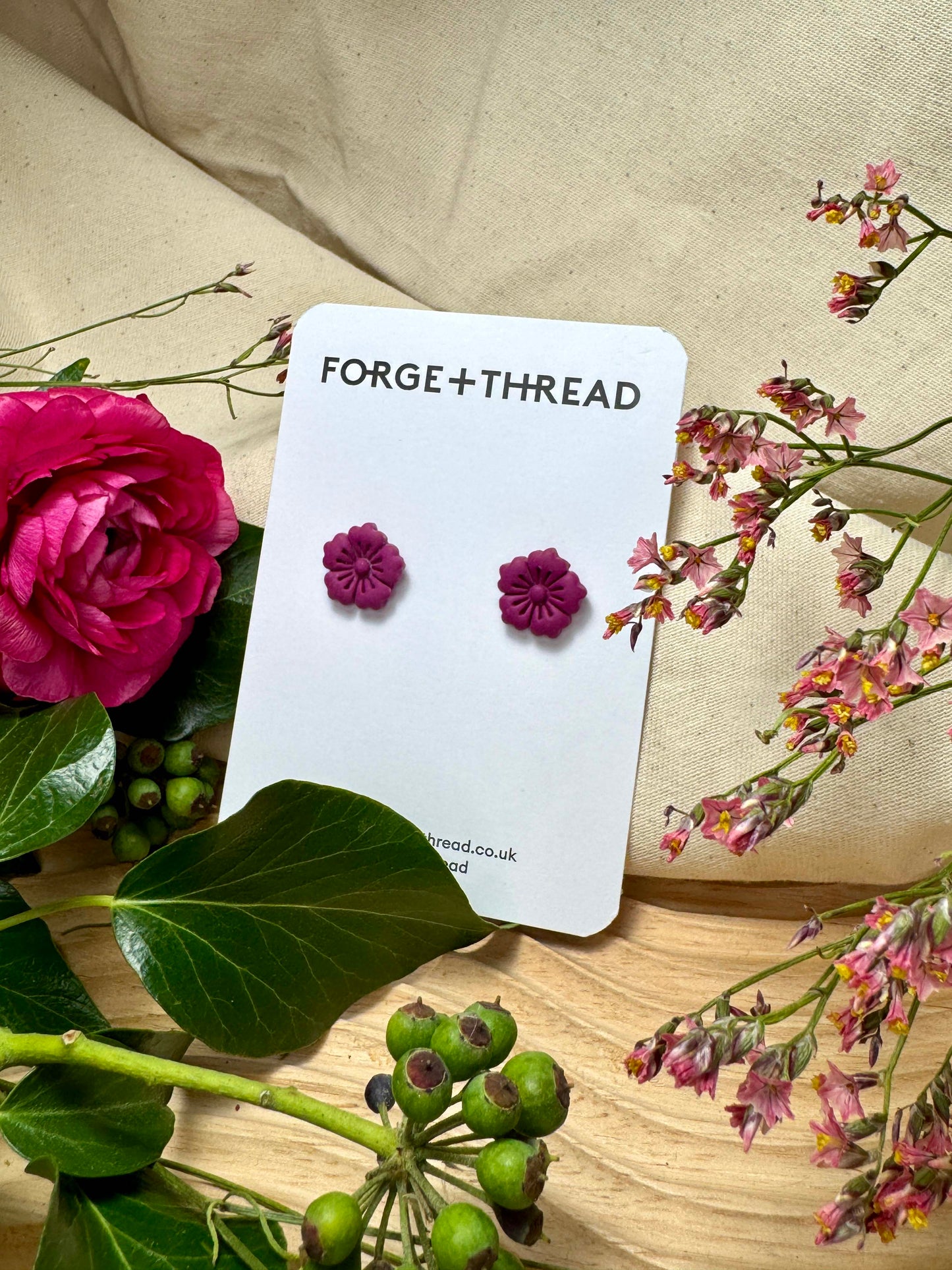 PURPLE FLOWER STUDS