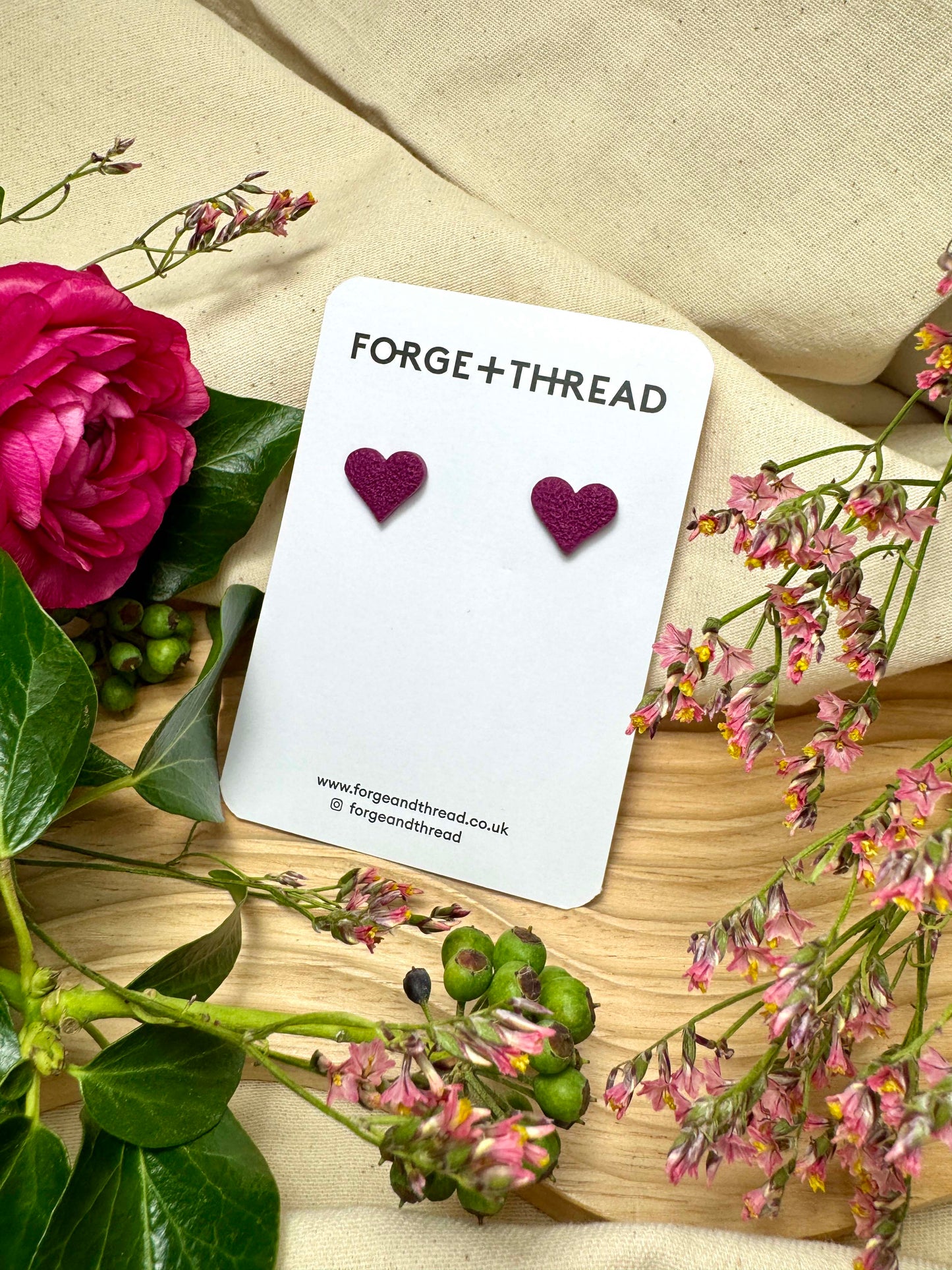PURPLE FLOWER STUDS