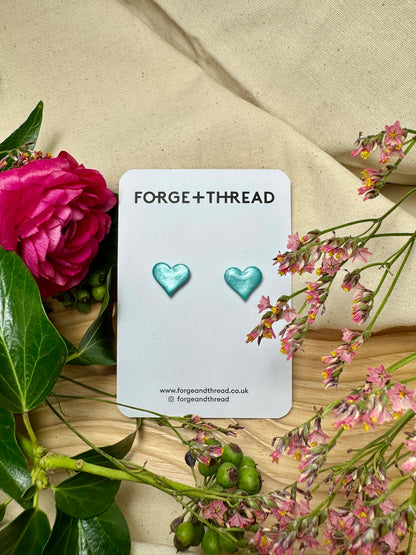 TURQUOISE METALLIC GLITTER HEART STUDS