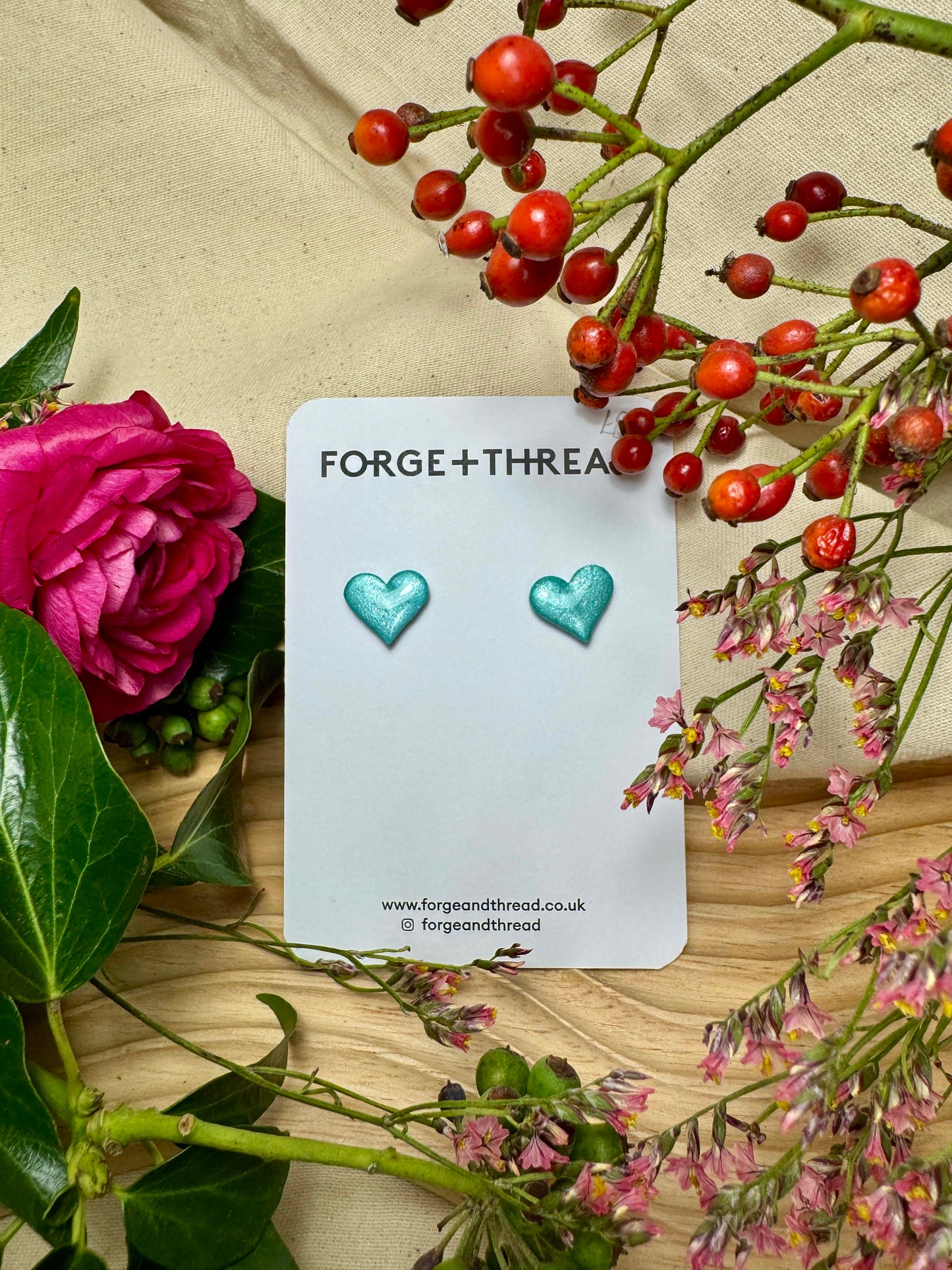 TURQUOISE METALLIC GLITTER HEART STUDS