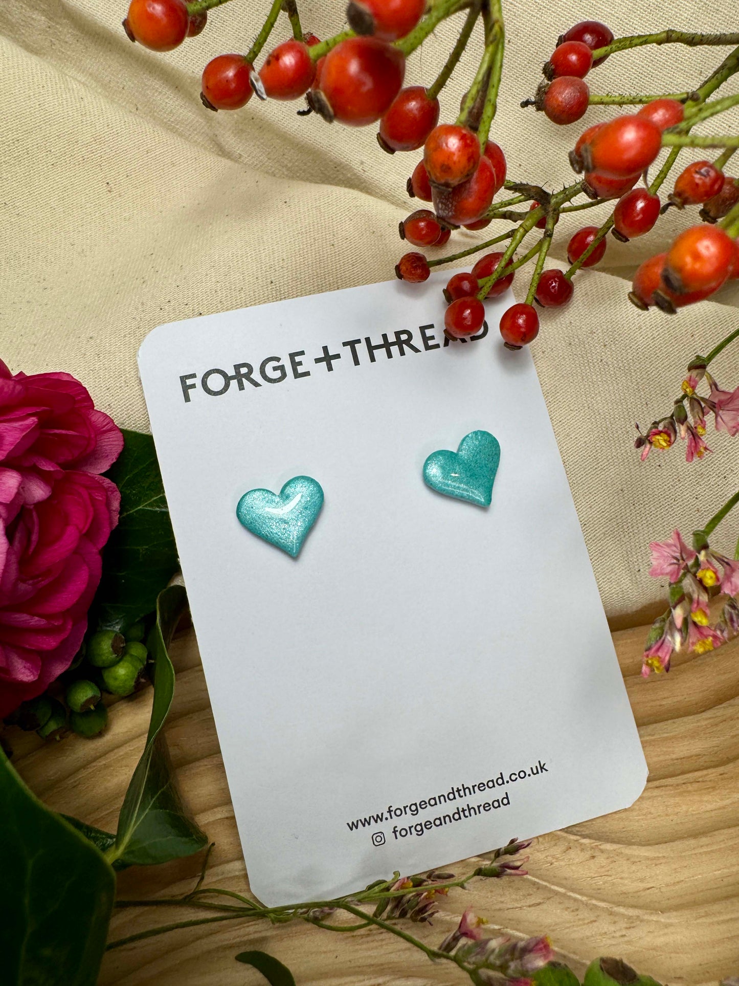 TURQUOISE METALLIC GLITTER HEART STUDS