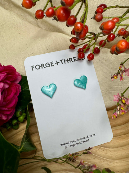 TURQUOISE METALLIC GLITTER HEART STUDS