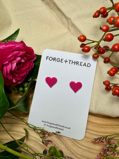 FUCHSIA PINK TEXTURED HEART STUDS