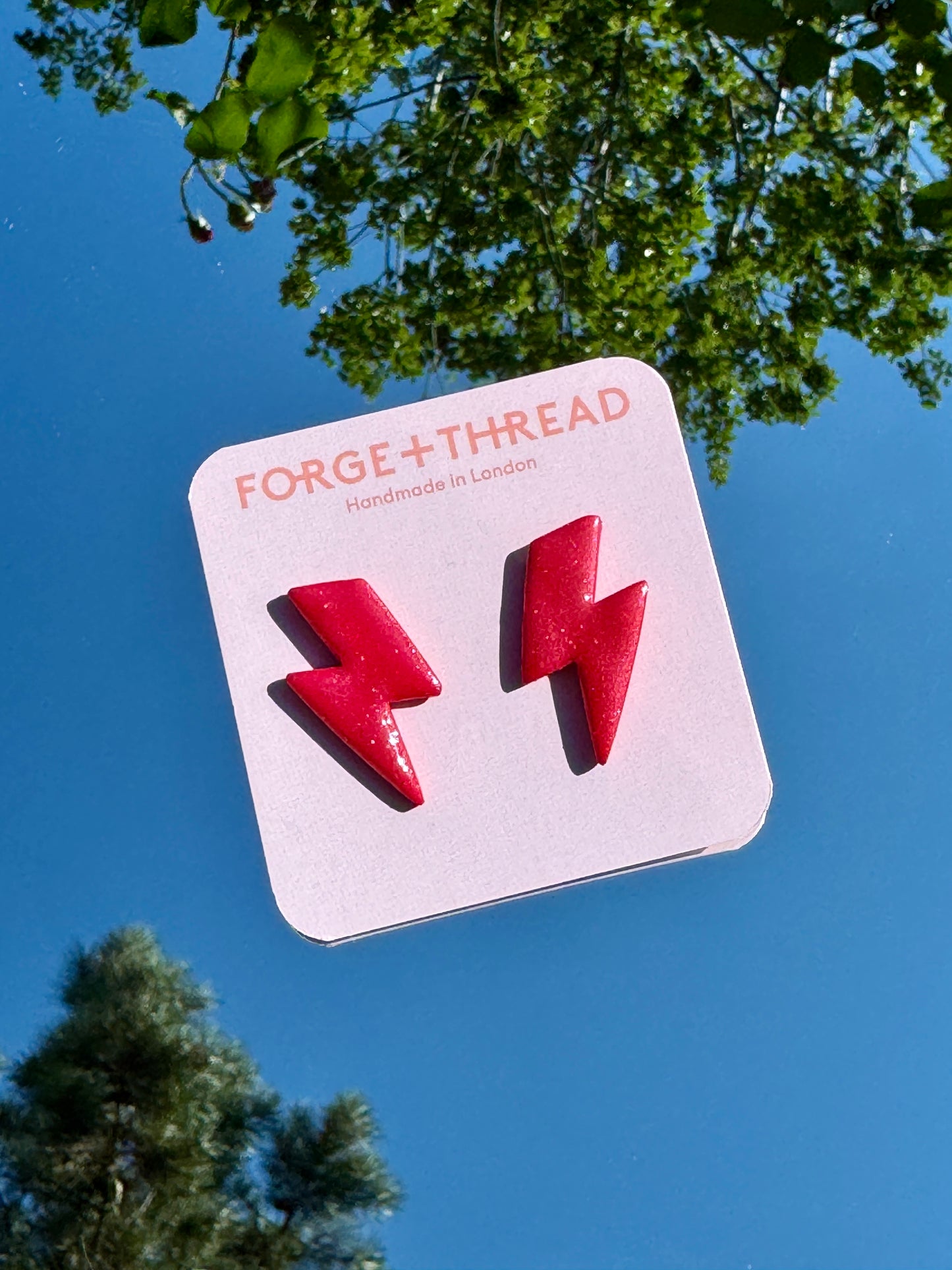 RED METALLIC LIGHTNING STUDS