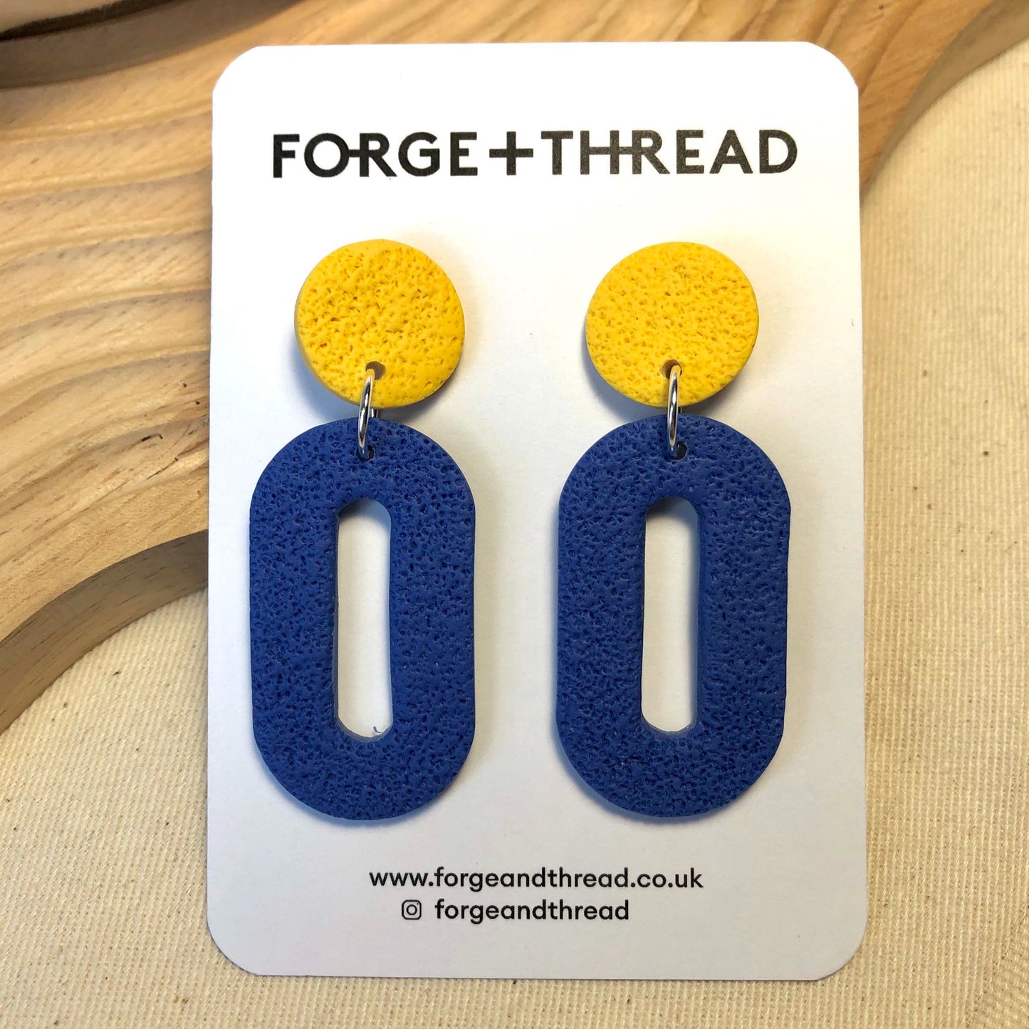 NAVY TEXTURED OVAL DROP EARRINGS