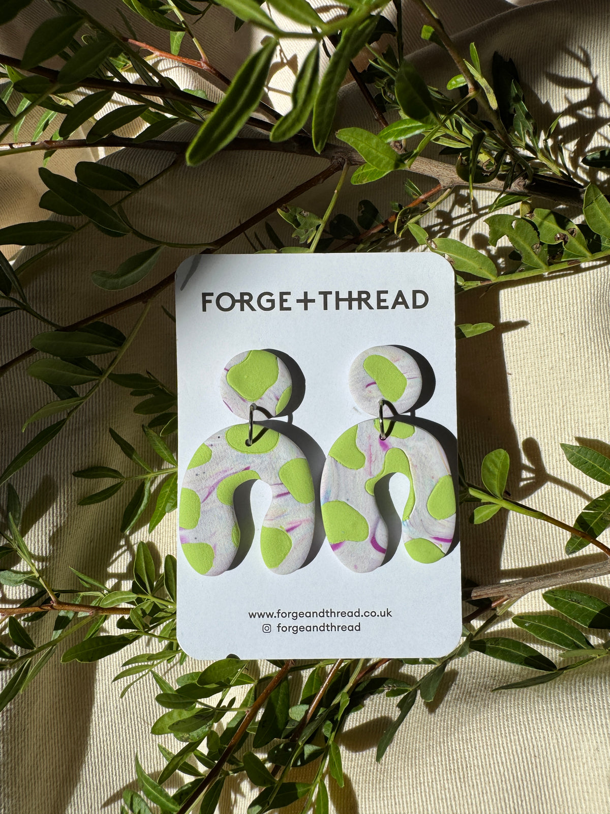 GREEN COW PATTERN WONKY ARCH EARRINGS