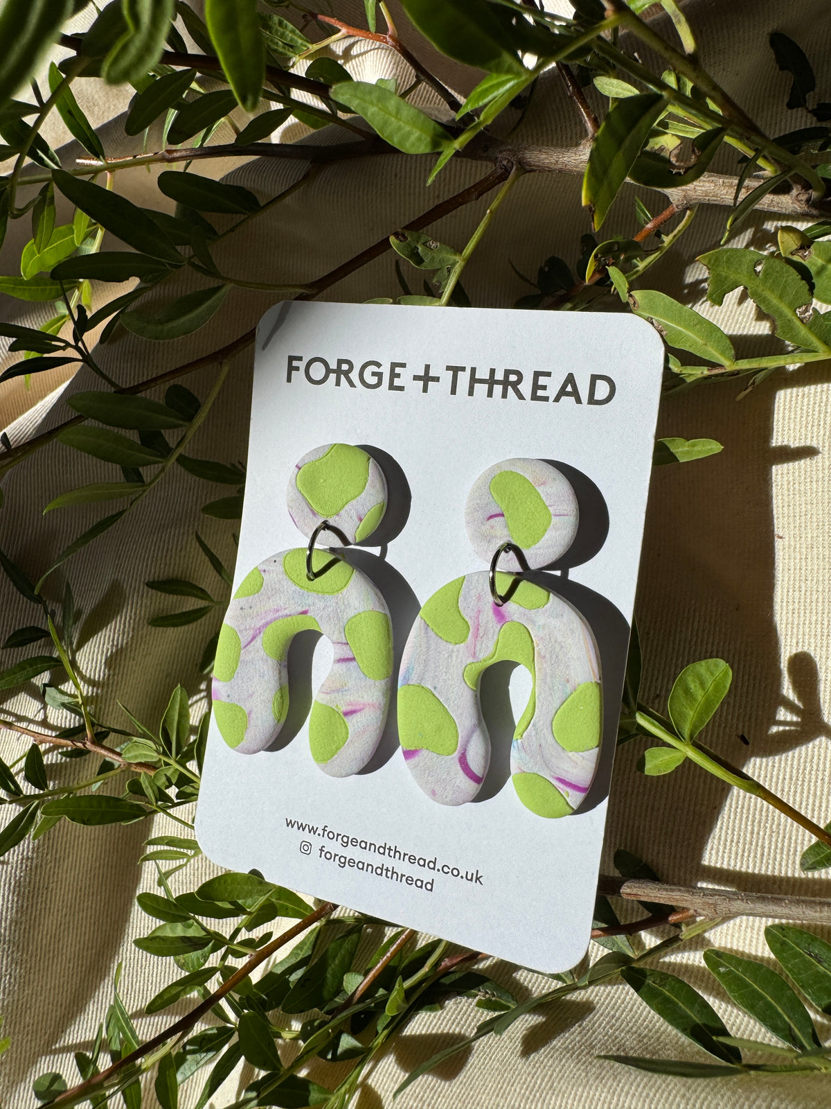 GREEN COW PATTERN WONKY ARCH EARRINGS