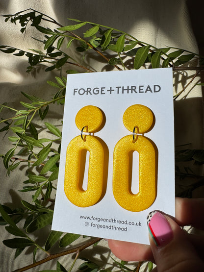 METALLIC YELLOW OVAL DROP EARRINGS