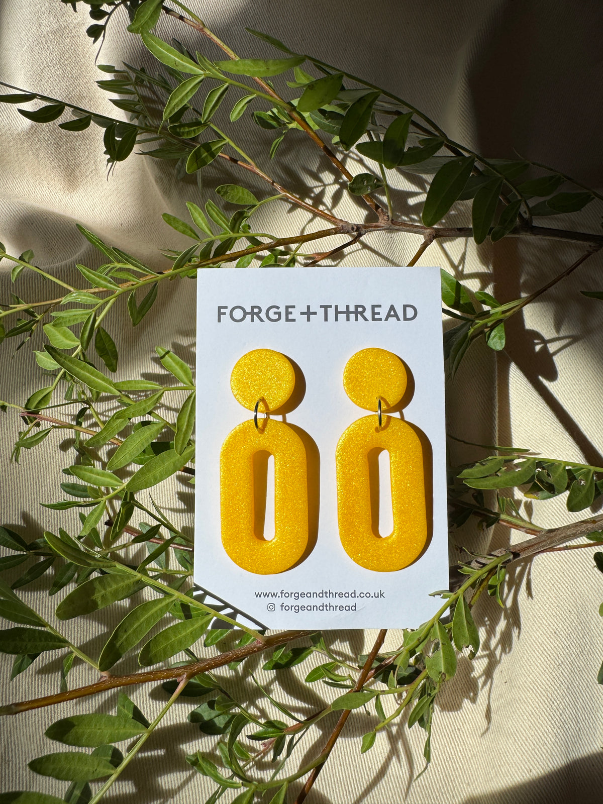 METALLIC YELLOW OVAL DROP EARRINGS