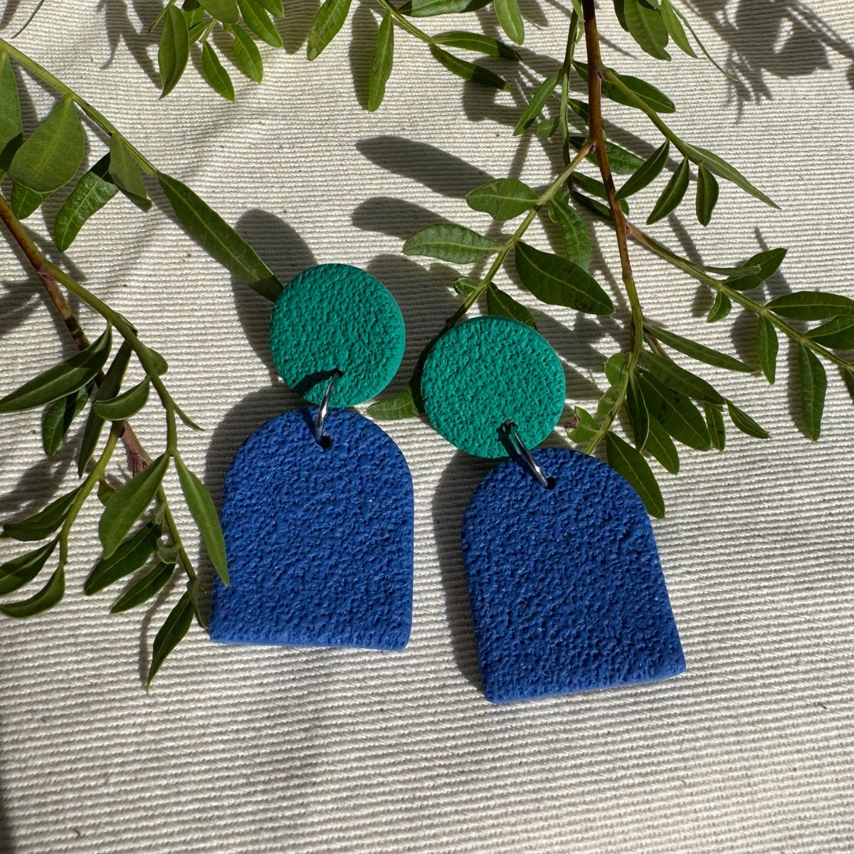 BLUE TEXTURED SMALL ARCH EARRINGS