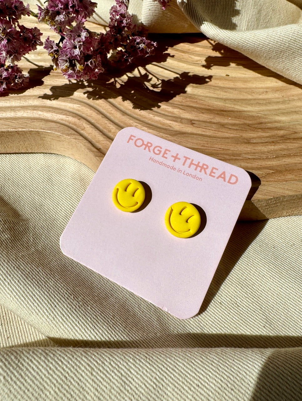 RAVE SMILEY STUDS
