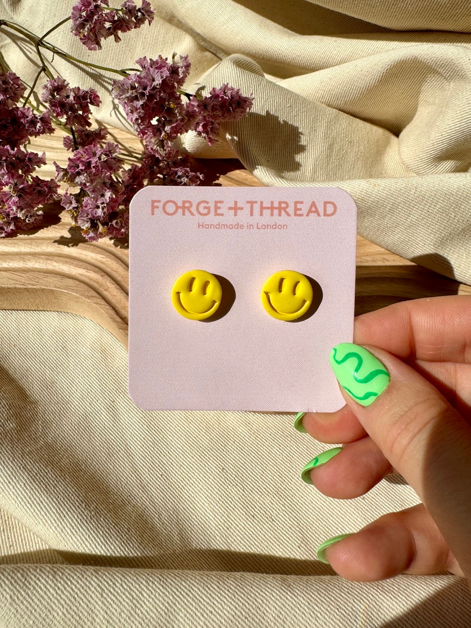 RAVE SMILEY STUDS
