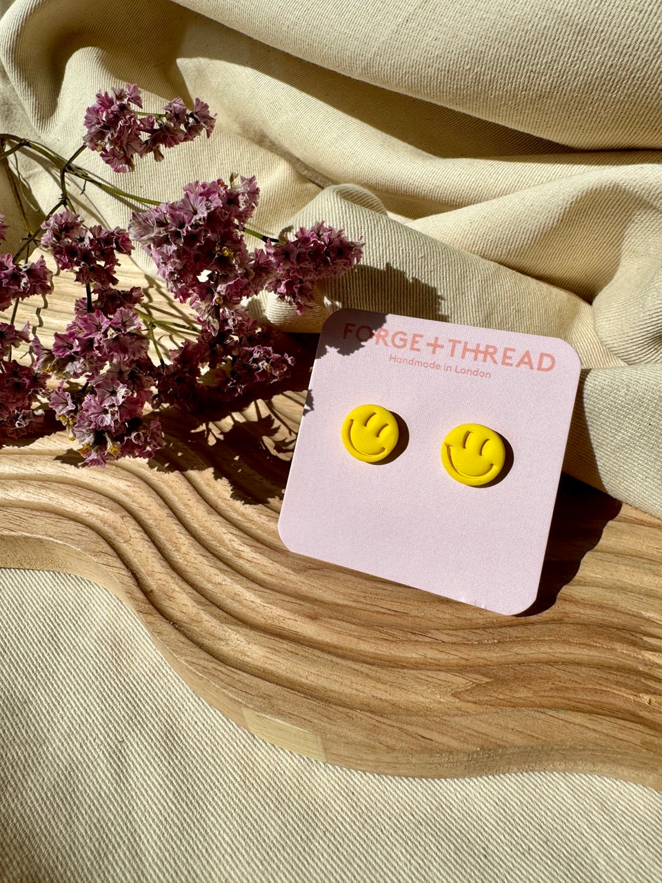 RAVE SMILEY STUDS