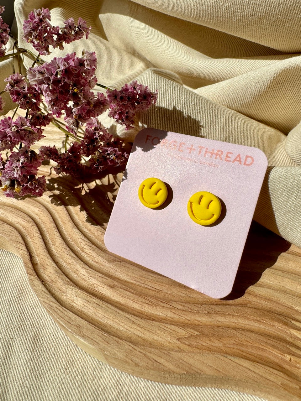 RAVE SMILEY STUDS